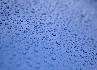Water droplets on blue surface