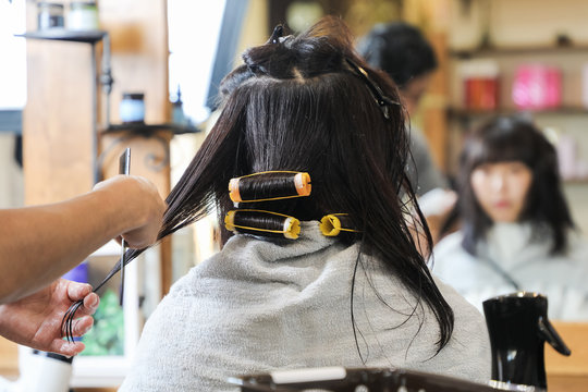 Young asian girl in hair salon.