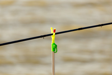 Fishing rod on the river bank