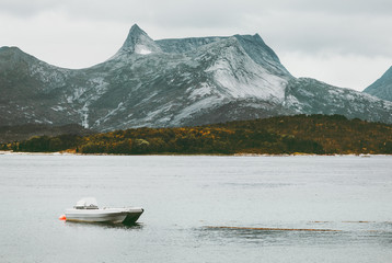 Rocky Mountains and fishing boat sea wild Landscape in Norway scandinavian Travel
