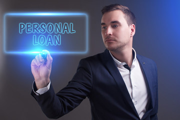 The concept of business, technology, the Internet and the network. Young businessman showing inscription: Personal loan