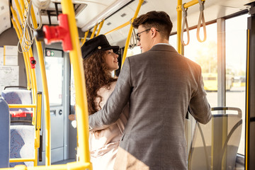stylish couple in public transport