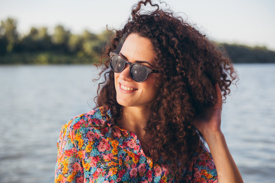 Portrait of a beautiful woman with curly hair