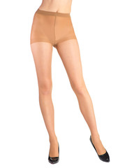 Shapely female legs dressed in tights body color