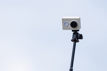 Action camera on a selfie stick.