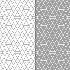 Gray and white geometric ornaments. Set of seamless patterns