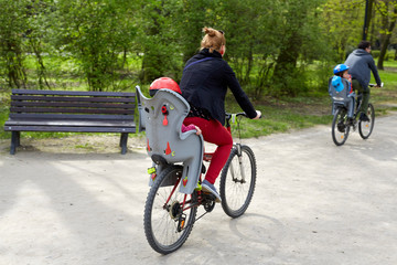 Family on bikes in the park