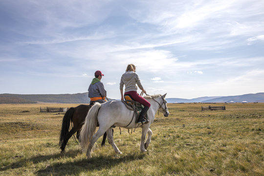 Couple Riding Mongolian Horses