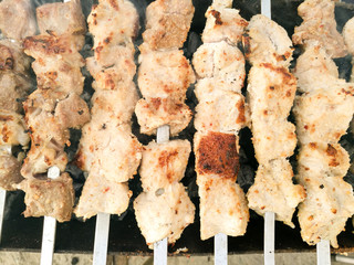 Shish kebab on metal sticks roasted on the grill