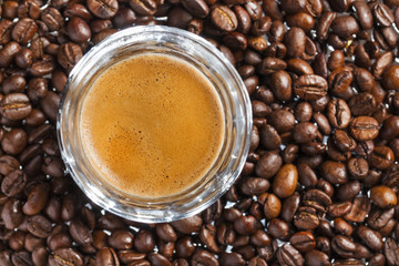 Double espresso and coffee beans