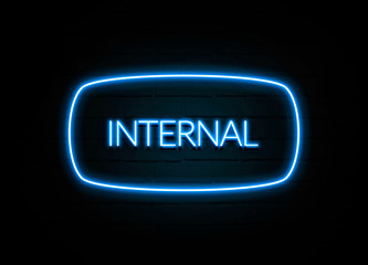 Internal  - colorful Neon Sign on brickwall