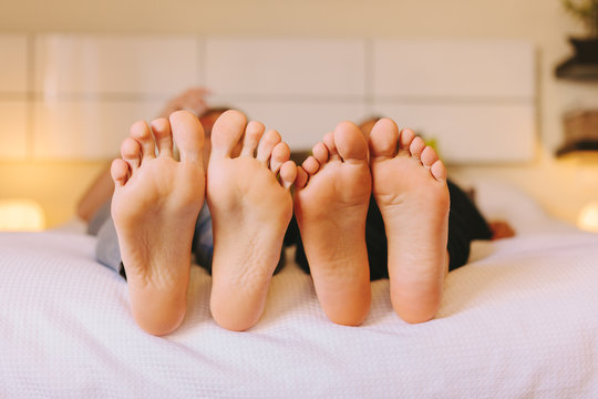 A pair of Women's Feet in Bed