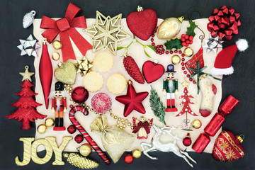Christmas bauble decorations with gold joy sign, mince pies, holly, fir, mistletoe and foil wrapped...