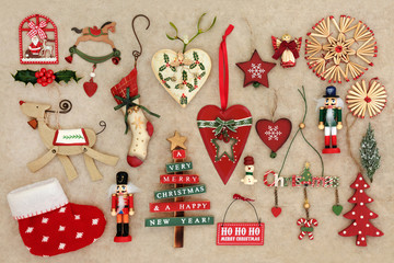 Fototapeta na wymiar Old fashioned christmas decorations on handmade hemp paper background