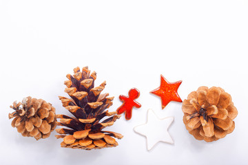 Background Christmas and New year Concept Pine cones and nuts with ceramic decoration  on white background