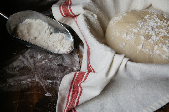 Home made bread dough rising in a proofing basket