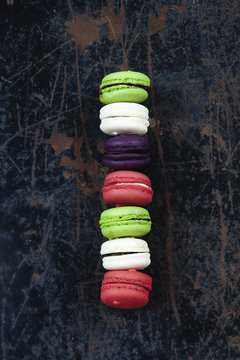 Colorful macaroons on a rustic background