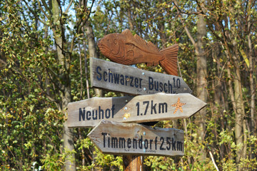 A unique wooden signpost on the island of Poel, Baltic Sea, Germany.
