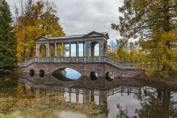 Autumn forest in Pushkin, marble bridge, Saint-Petersburg, Russia