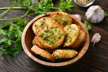 Homemade toasts with cheese, greens and garlic