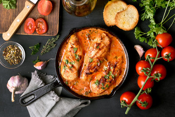 Tasty chicken breast with tomato sauce