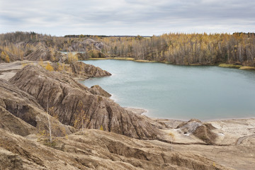 Turquoise quarry at Romantsevo (village Konduki). Autumn landscape