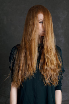portrait of  girl with long red hair