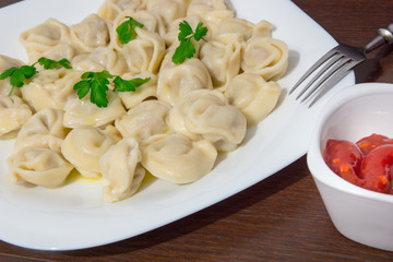 Italian ravioli with tomato sauce and fresh parsley