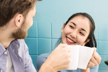 women and man Clink  hot coffee in morning