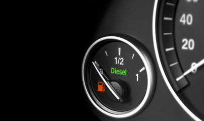 close up of a modern car interior dashboard details. Fuel level. Diesel engine