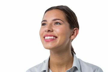 Female executive smiling against white background