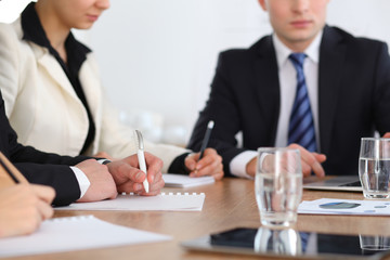 Group of business people or lawyers  at meeting, hands close-up