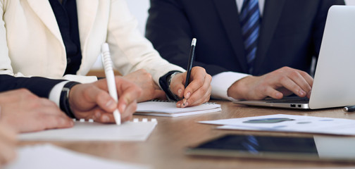 Group of business people or lawyers  at meeting, hands close-up