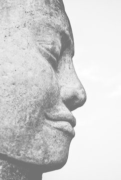 Stone Buddha Face Statue In Angkor Wat, Cambodia