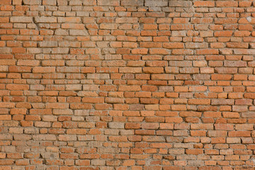 Ancient wall made by red brick