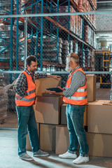 Fototapeta premium warehouse workers with clipboard