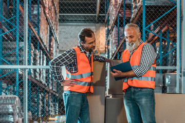 warehouse workers with clipboard