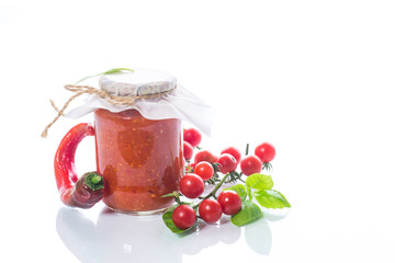 Homemade organic tomato sauce in a glass jar