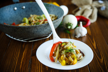 eggplant with vegetables fried in a wok