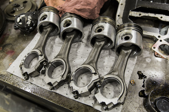 Piston on Workbench in Auto Repair Shop