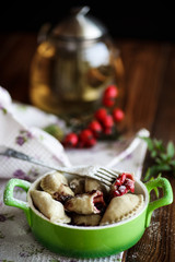 sweet dumplings with cherries in a bowl