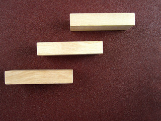 Burgundy floor stairs made of wooden blocks,career 