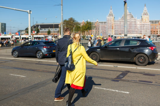 Young Couple Is Crossing The Road In Wrong Place, Amsterdam