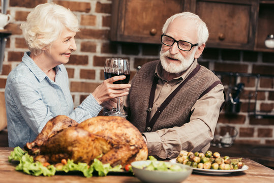 Senior Couple Drinking Wine On Thanksgiving