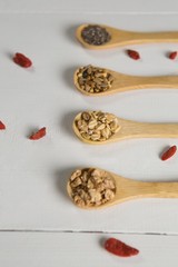 Fototapeta na wymiar Various oatmeal in wooden spoon