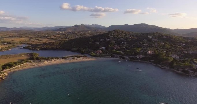 Aerial, beautiful bay in Sardinia island on sunset, 4K