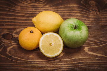 Fresh organic fruits on wooden table