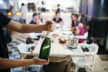 the waiter hands with champagne