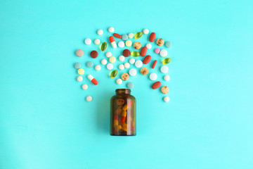 Medical pills and a bottle lie on the table. Medical concept