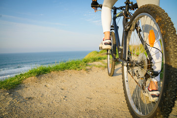 Fototapeta na wymiar Enjoying a relaxing biking ride on the seaside